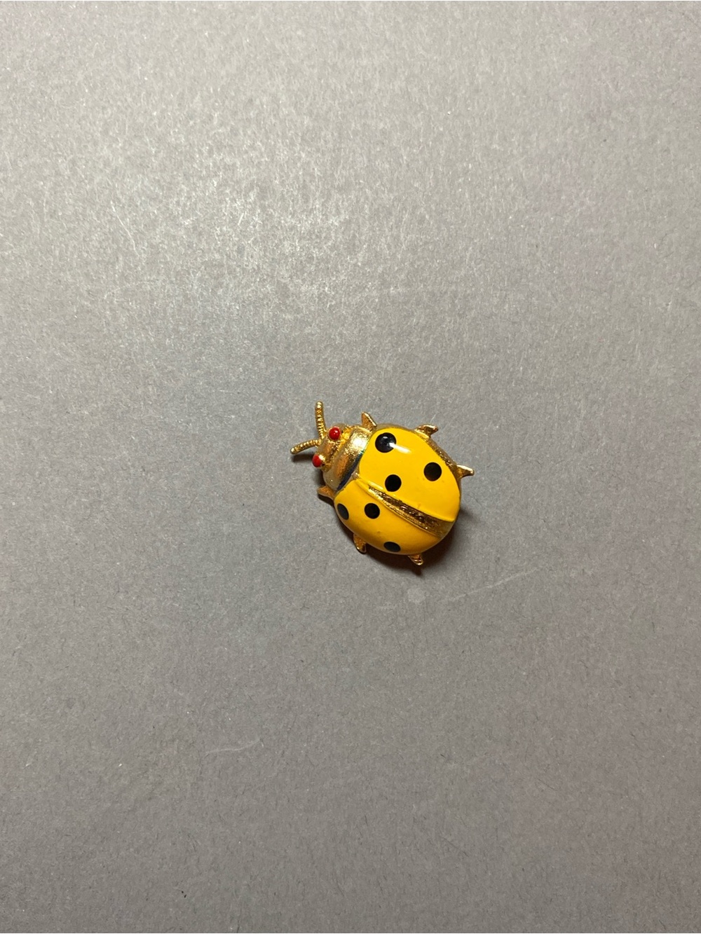 Vintage small yellow ladybug pin